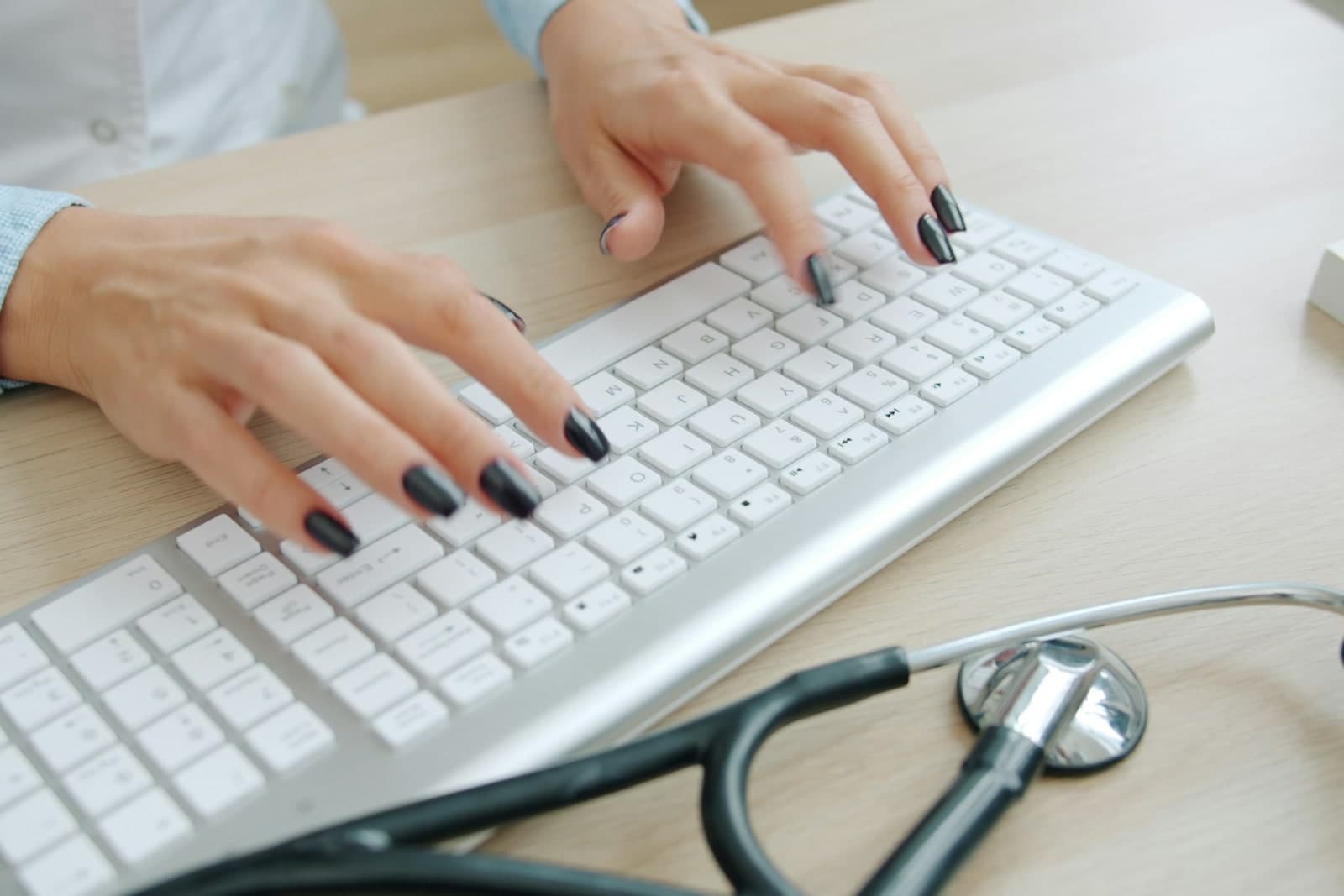 Clinical keyboard and stethoscope representing digital health evidence preparation.