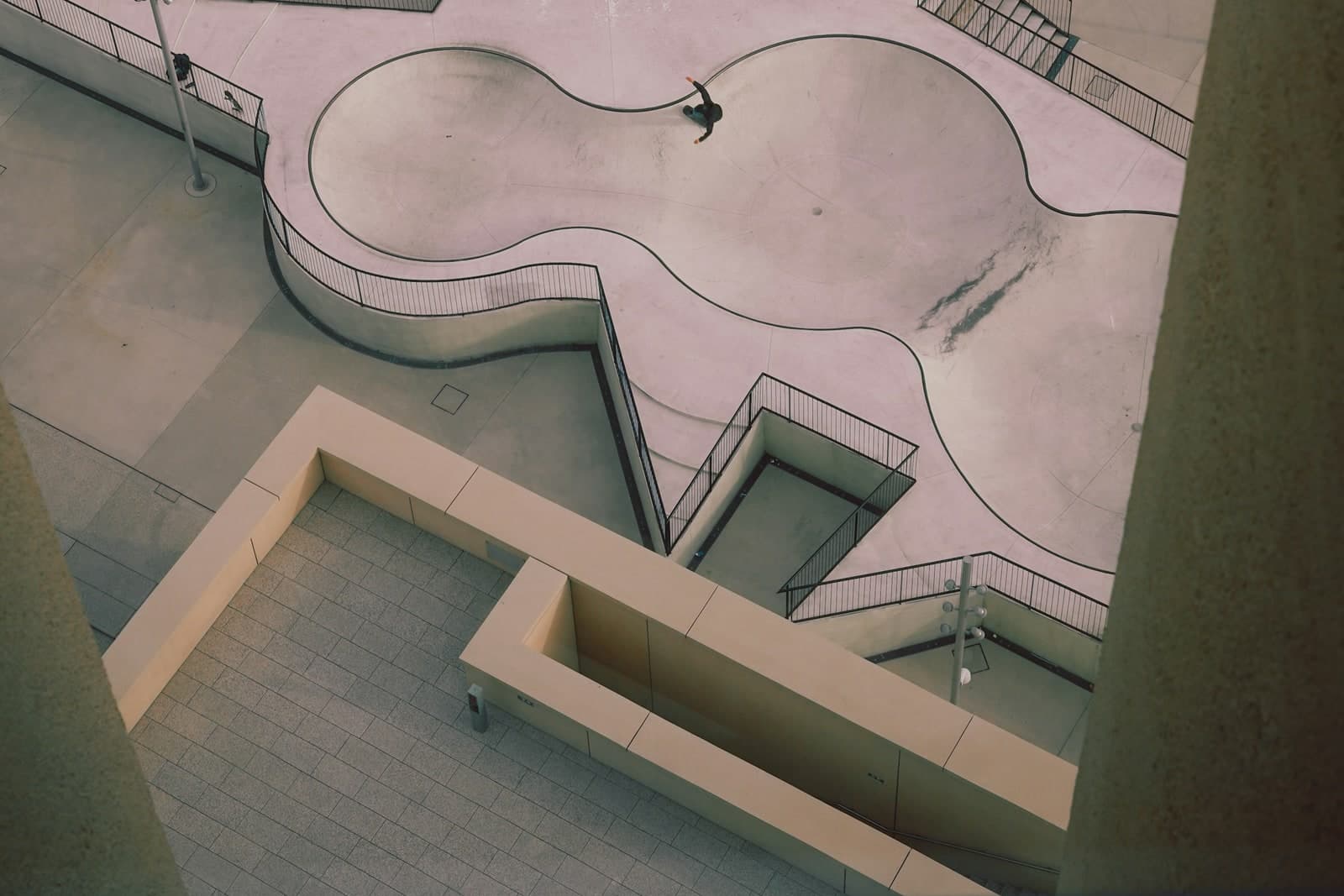 Bright geometric architecture viewed from above, suggesting international pathway planning.