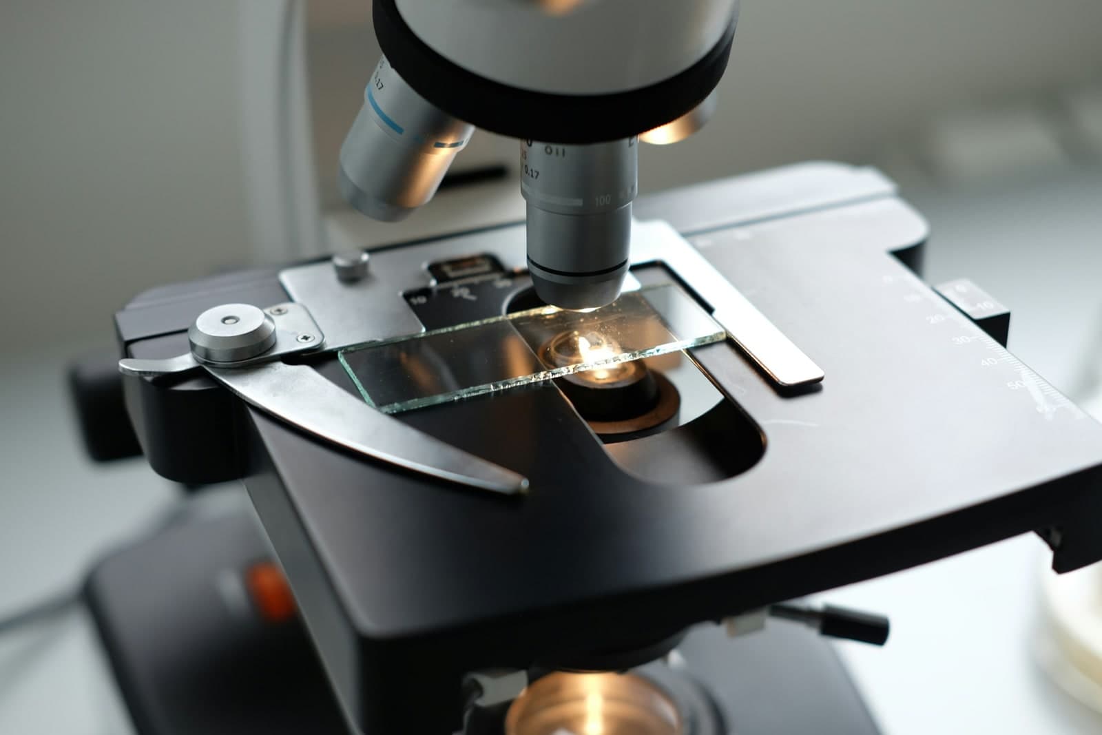 Microscope and laboratory equipment used for medical technology evidence work.