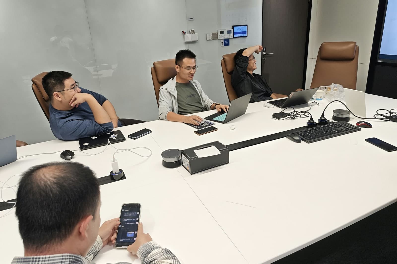 Business meeting with laptops, representing specialist network coordination.